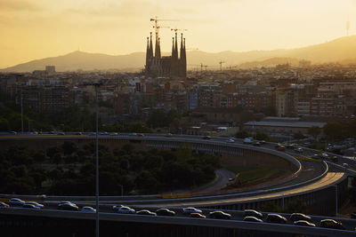 Aerial view of the city of barcelona at sunset and the sagrada familia by antoni gaudi