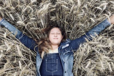 Portrait of happy woman on field