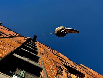 Low angle view of street light against sky