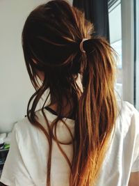 Rear view of woman at home