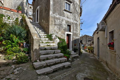 Narrow alley amidst buildings in city