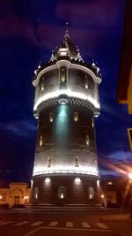 Low angle view of illuminated building at night