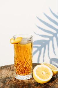 Yellow drink on glass table