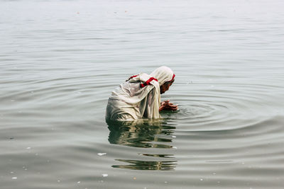 High angle view of man swimming in lake