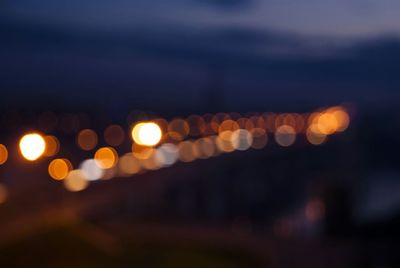 Defocused image of illuminated lights at night