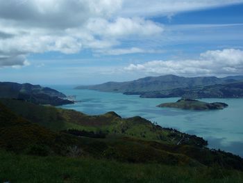 Scenic view of lake and mountains against sky