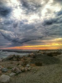 Scenic view of sea against cloudy sky