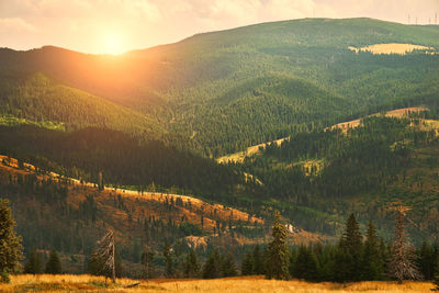 Scenic view of mountains against sky during sunset