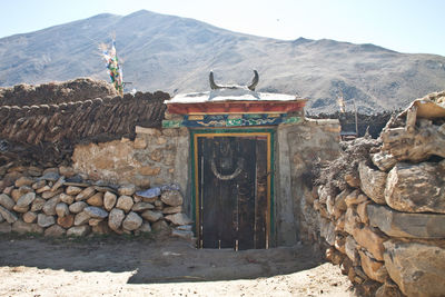 Statue of temple against mountain