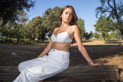 Portrait of young woman sitting outdoors