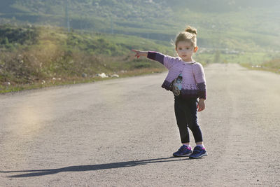 Full length of a girl on road