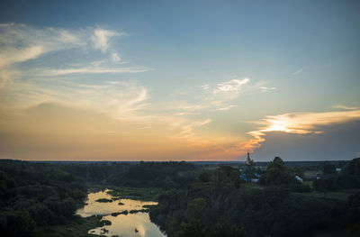 Scenic view of landscape against sky during sunset