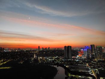 Cityscape against sky during sunset