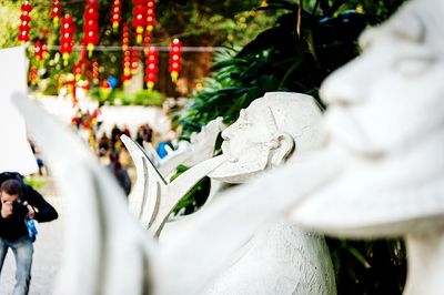 Close-up of statue against trees