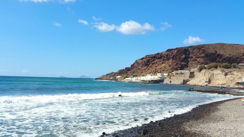 View of beach against blue sky