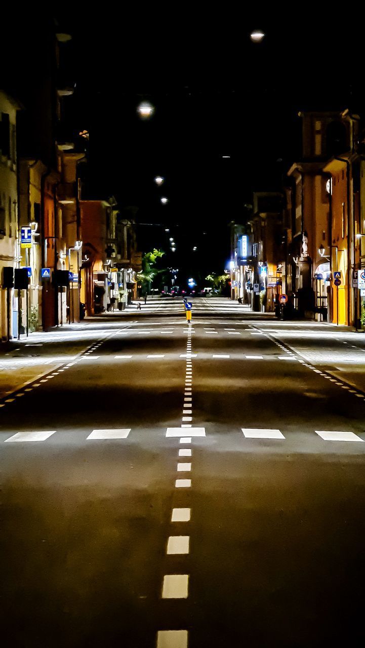 SURFACE LEVEL VIEW OF ILLUMINATED CITY STREET