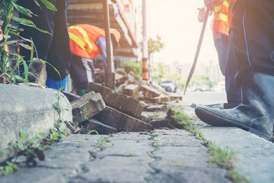 Close-up of rusty jackhammer on road at construction site