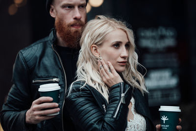 Young couple looking at camera