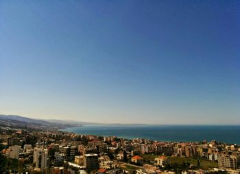 Scenic view of sea and cityscape