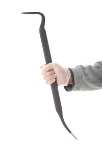 Close-up of man holding hands against white background