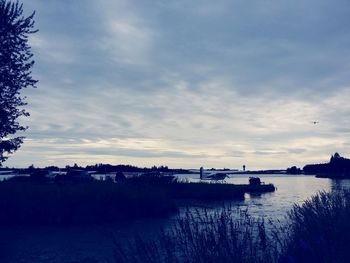 Scenic view of calm lake at sunset