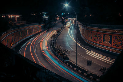 High angle view of light trails on road at night