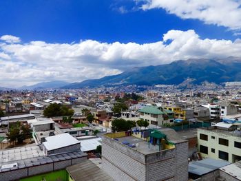 High angle view of townscape against cloudy sky