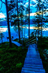 Scenic view of trees against blue sky