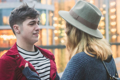 Couple in warm clothing standing outdoors