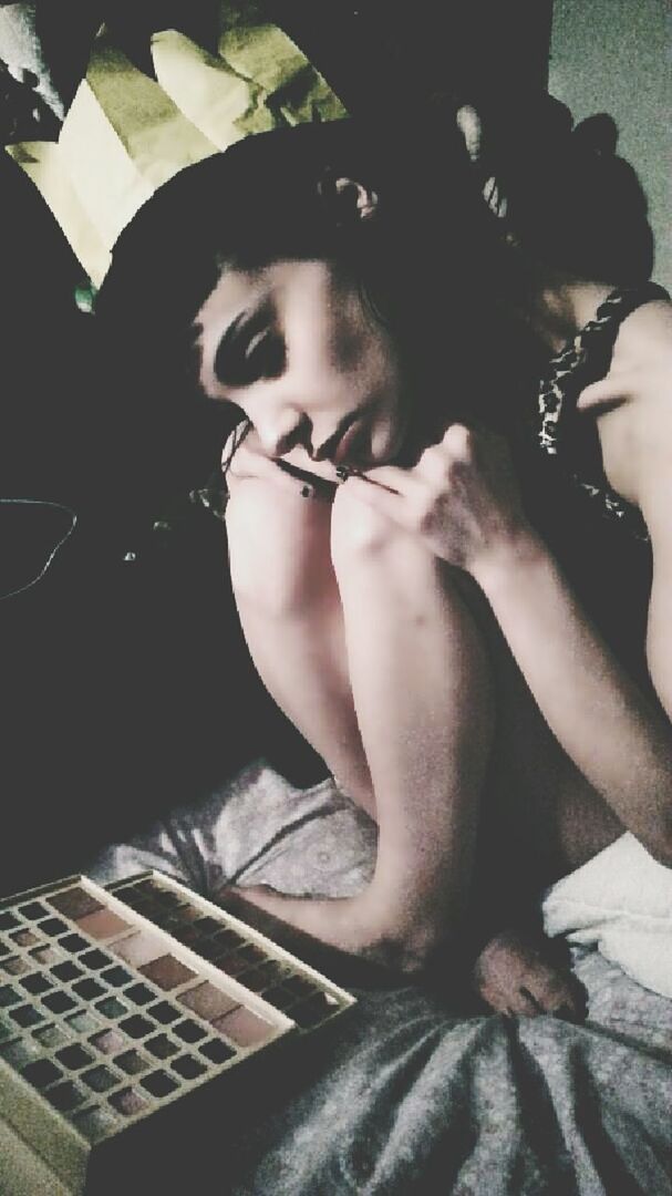 CLOSE-UP OF YOUNG WOMAN SMOKING ON FLOOR