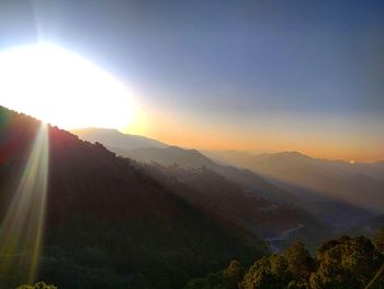 Scenic view of mountains against sky during sunset