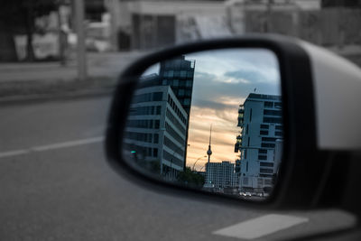 Reflection of sky on side-view mirror