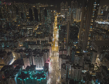 Aerial view of illuminated modern buildings in city at night