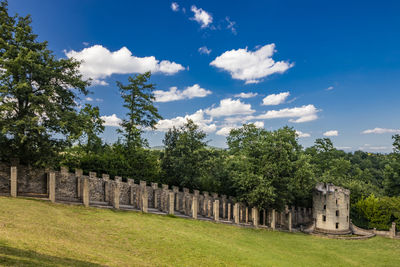 Built structure on field against sky