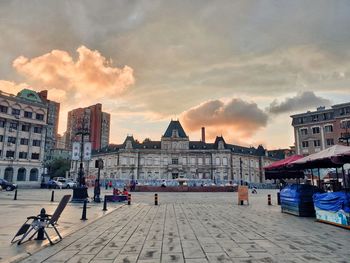 Buildings in city at sunset