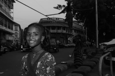 Portrait of woman standing on street