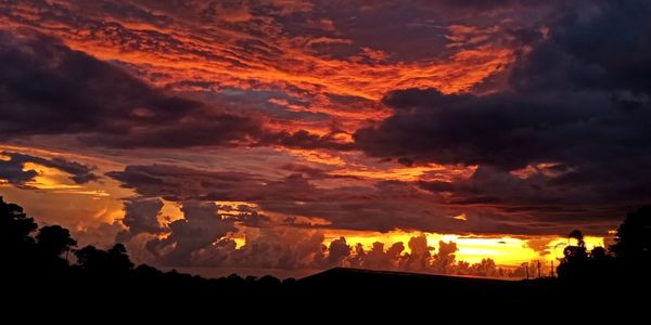 Low angle view of dramatic sky during sunset