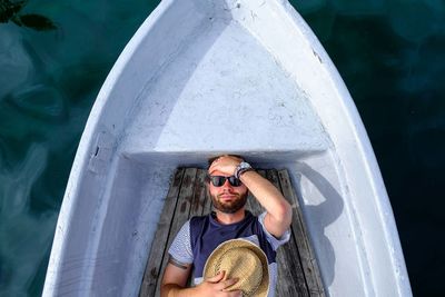 Directly above shot of man sleeping in boat