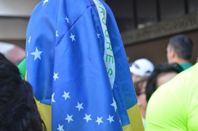 Close-up of person wearing brazilian flag 