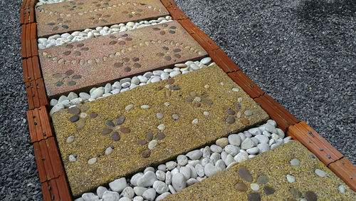 High angle view of stones on footpath