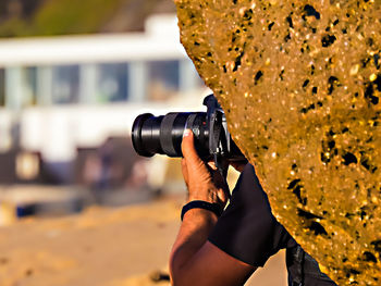 Midsection of woman photographing