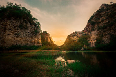 Scenic view of lake against sky during sunset