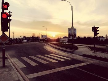 Road sign at sunset