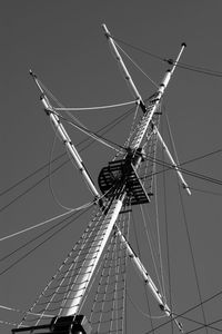 Low angle view of cranes against sky