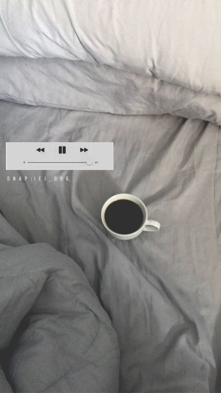 bed, cup, coffee, indoors, drink, coffee - drink, coffee cup, refreshment, mug, furniture, technology, food and drink, communication, bedroom, relaxation, white color, high angle view, connection, directly above, domestic room