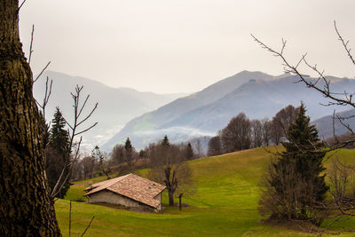 Scenic view of landscape and mountains against sky