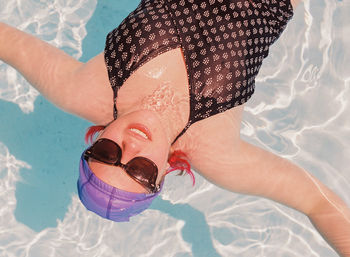 High angle view of woman swimming in pool