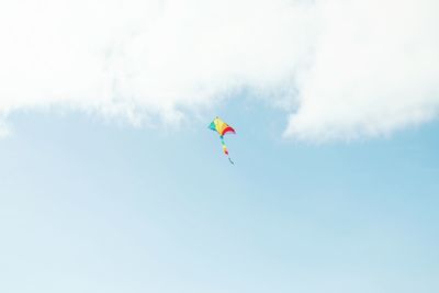 Low angle view of kite flying in sky