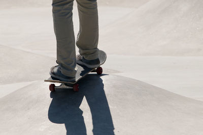 Low section of man skateboarding