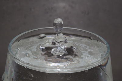 Close-up of water splashing in glass